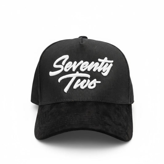 Black cap with 'Seventy Two' text in white on a white background